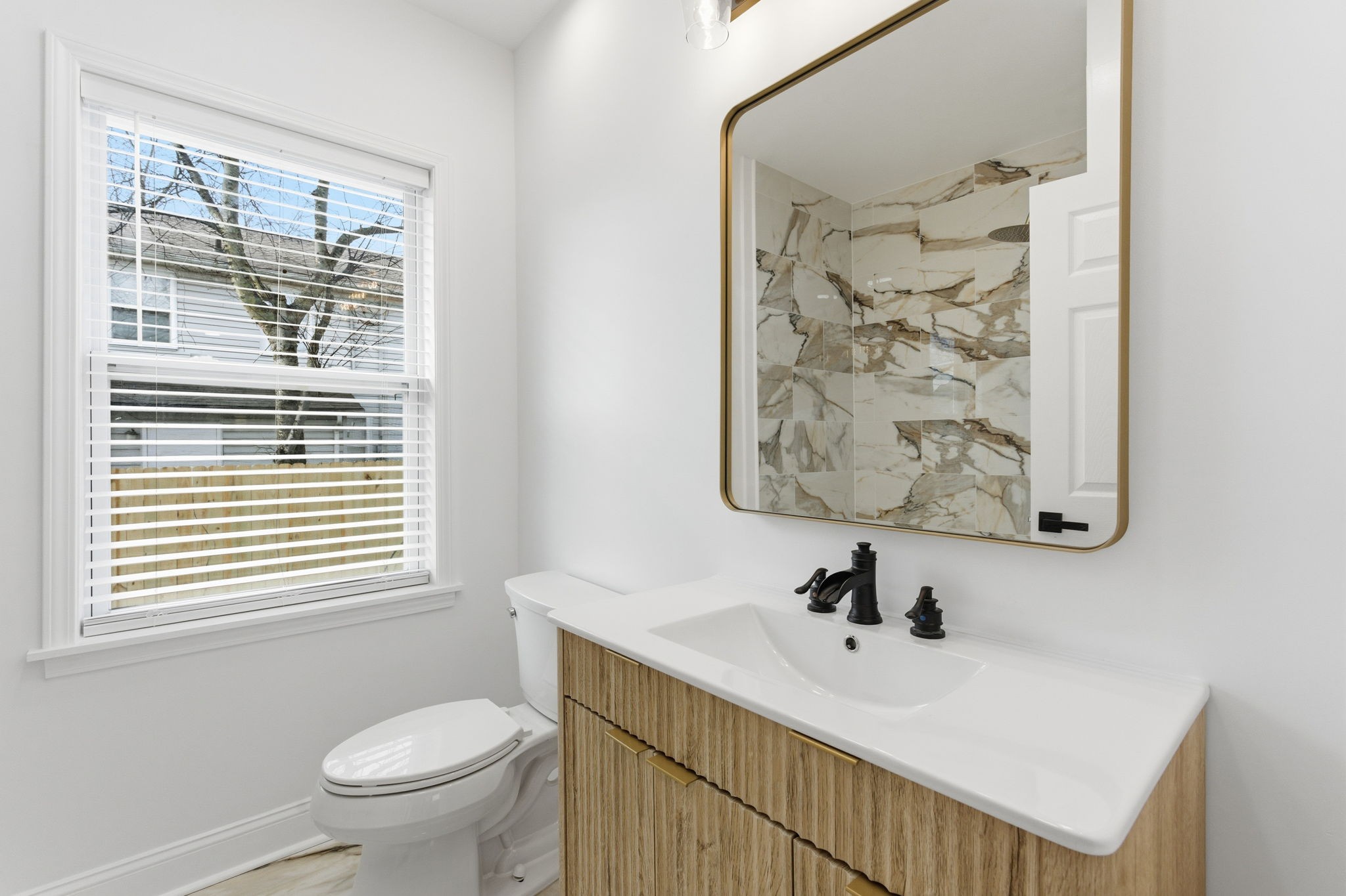 1106 Dodson Street Old Hickory, TN 37138 - Photo 13 of 27 a bathroom with a sink a toilet and a window