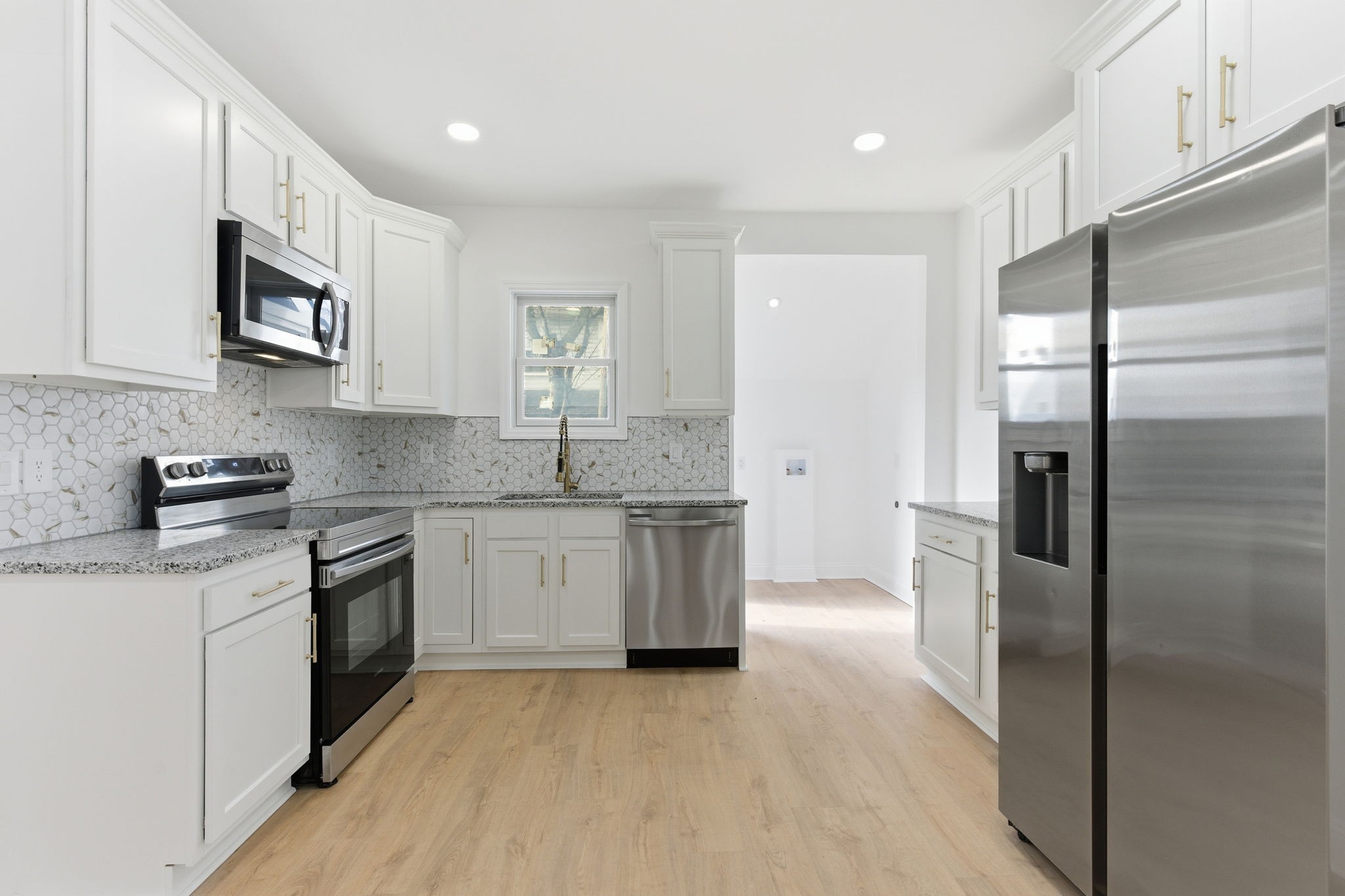 1106 Dodson Street Old Hickory, TN 37138 - Photo 10 of 27 a kitchen with stainless steel appliances granite countertop a refrigerator sink and stove