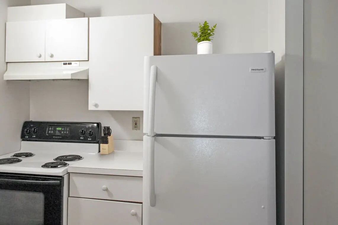 330 Main Street Fairhaven, MA 02719 - Photo 7 of 15 a white refrigerator freezer sitting inside of a kitchen