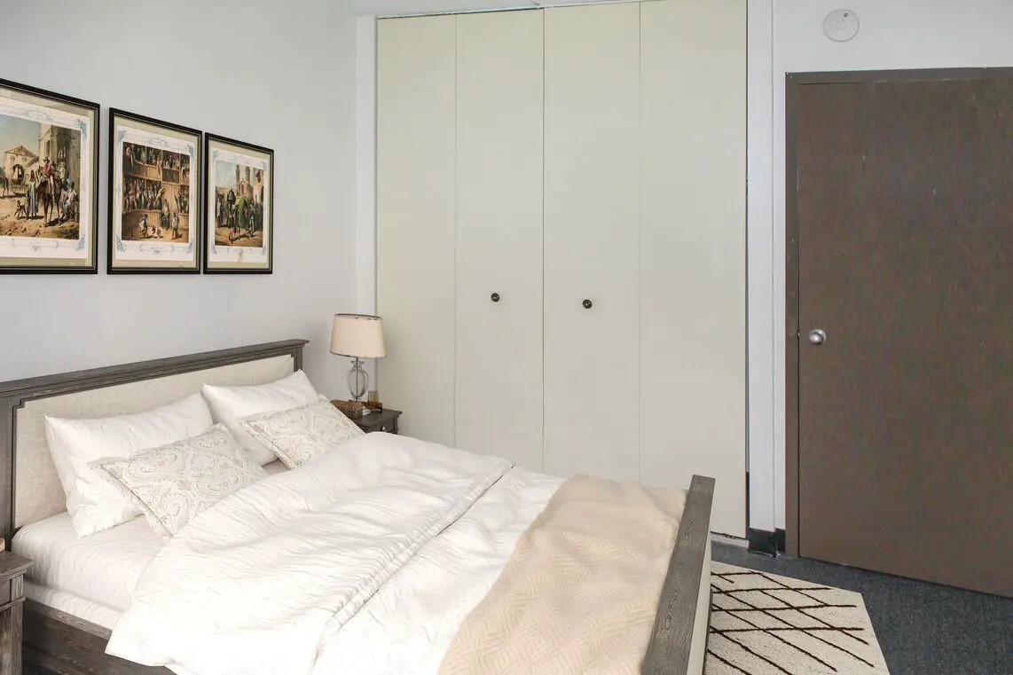330 Main Street Fairhaven, MA 02719 - Photo 10 of 15 a bedroom with a bed and wooden floor