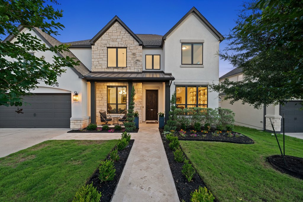1221 Siena Sunset Road Leander, TX 78641 - Photo 3 of 39 Contemporary exterior showcasing stucco and natural stone accents