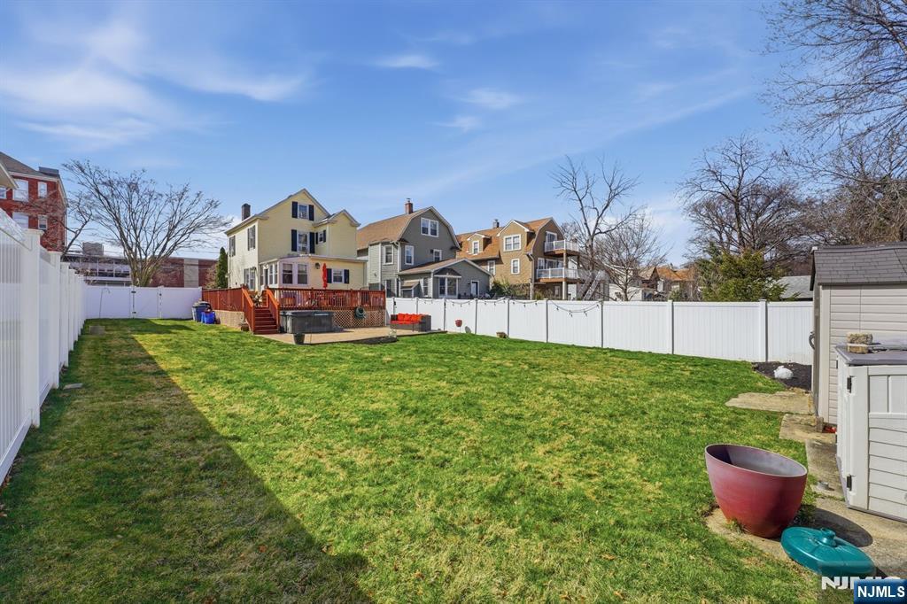 385 Berkeley Avenue Bloomfield, NJ 07003 - Photo 33 of 39 a view of a house with a yard and a garden