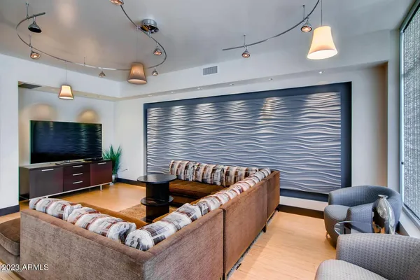 a living room with furniture fireplace and a flat screen tv