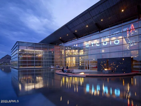 view of parking with lots of cars parked in front of it