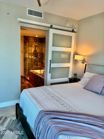 a bedroom with a bed and a dresser