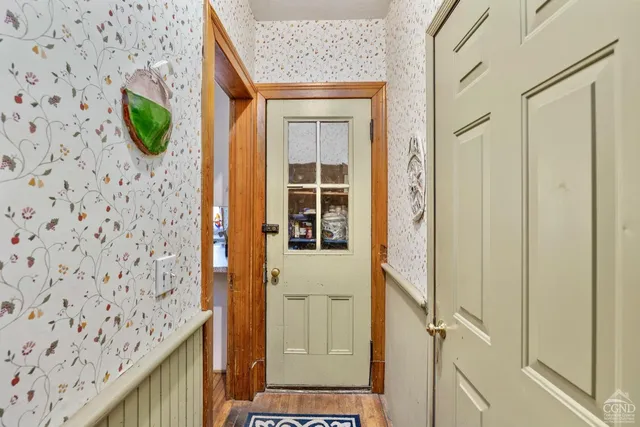 a view of stairs with wooden floor and stairs