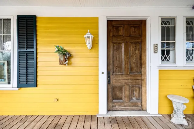 a view of entryway with wooden floor and stairs