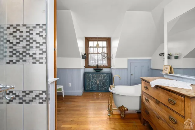 a storage room with furniture and a rug