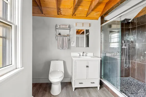 a balcony with table and chairs