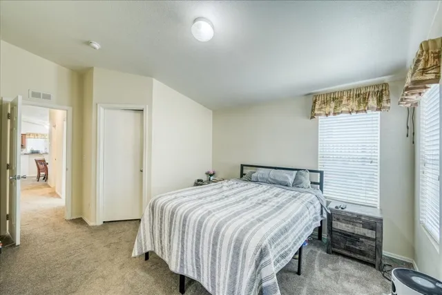 a bedroom with a bed and a cabinets