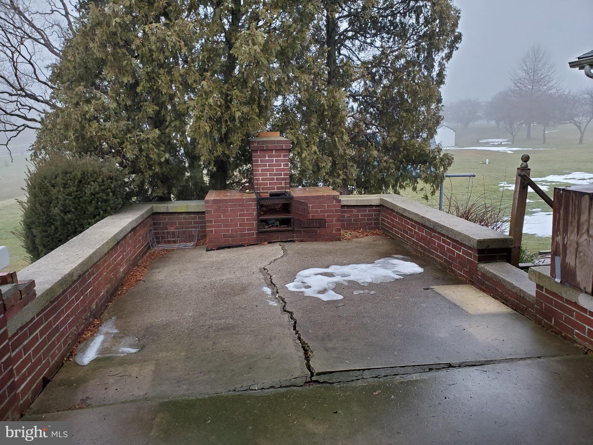 99 Blue Stone Road York, PA 17406 - Photo 3 of 17 patio extension off the carport with fireplace