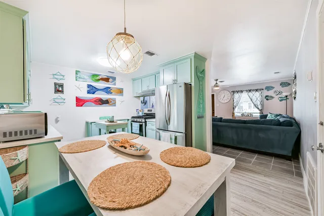 a dining room with furniture and window