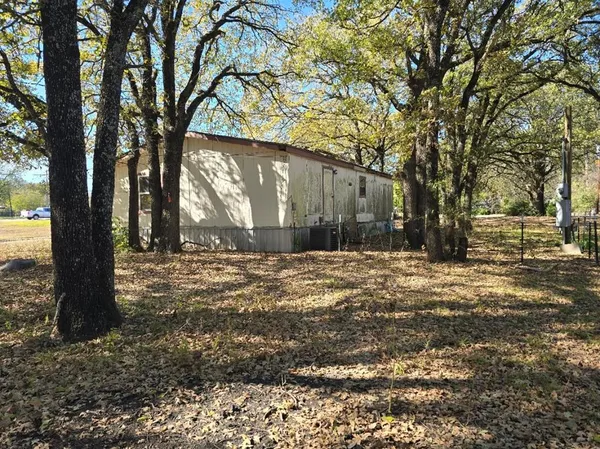 a view of a yard with trees
