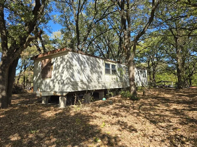 a view of a backyard of a house