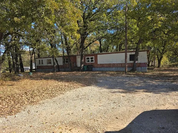 a view of a backyard of a house