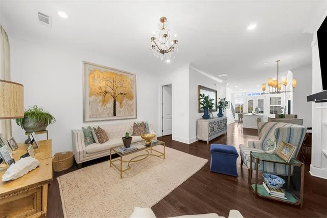 a living room with furniture window and wooden floor