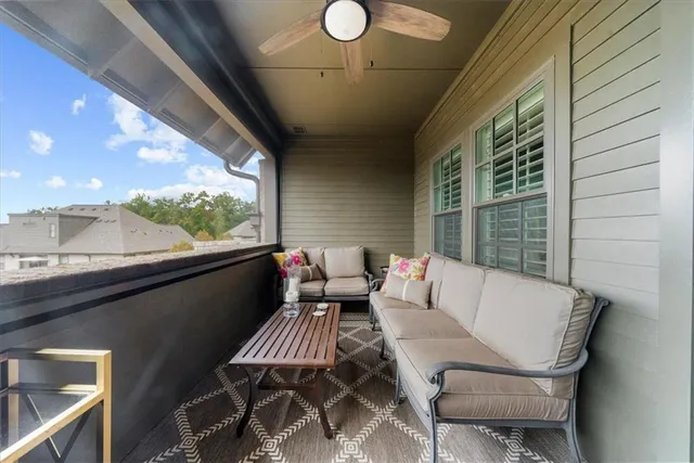 a bedroom with a bed a dresser with wooden floor