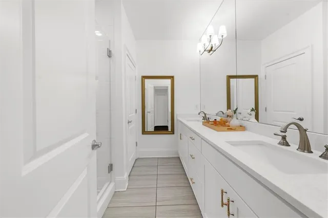 a bed room with a bed window and a flat screen tv