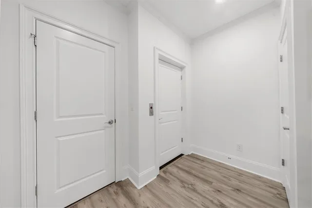 a aerial view of a brick house next to a yard