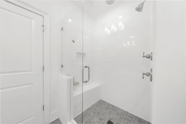 a front view of a house with a large window