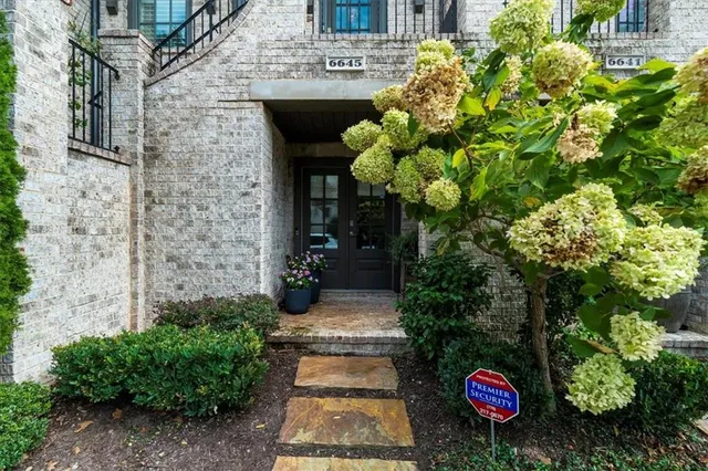 a view of entryway with wooden floor and stairs