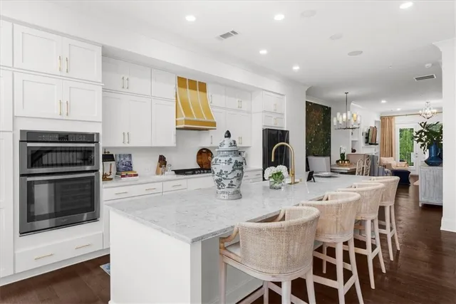a kitchen with sink stove and cabinets