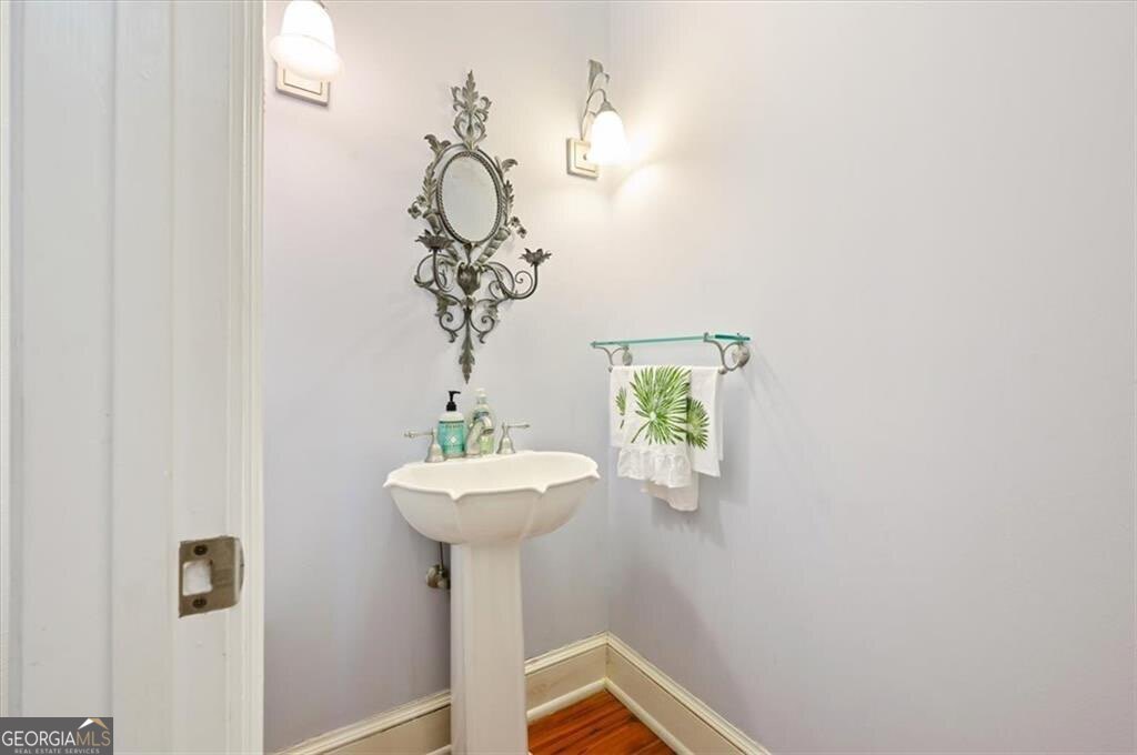 1045 River Club Road Northeast Townsend, GA 31331 - Photo 22 of 85 a bathroom with a sink and mirror