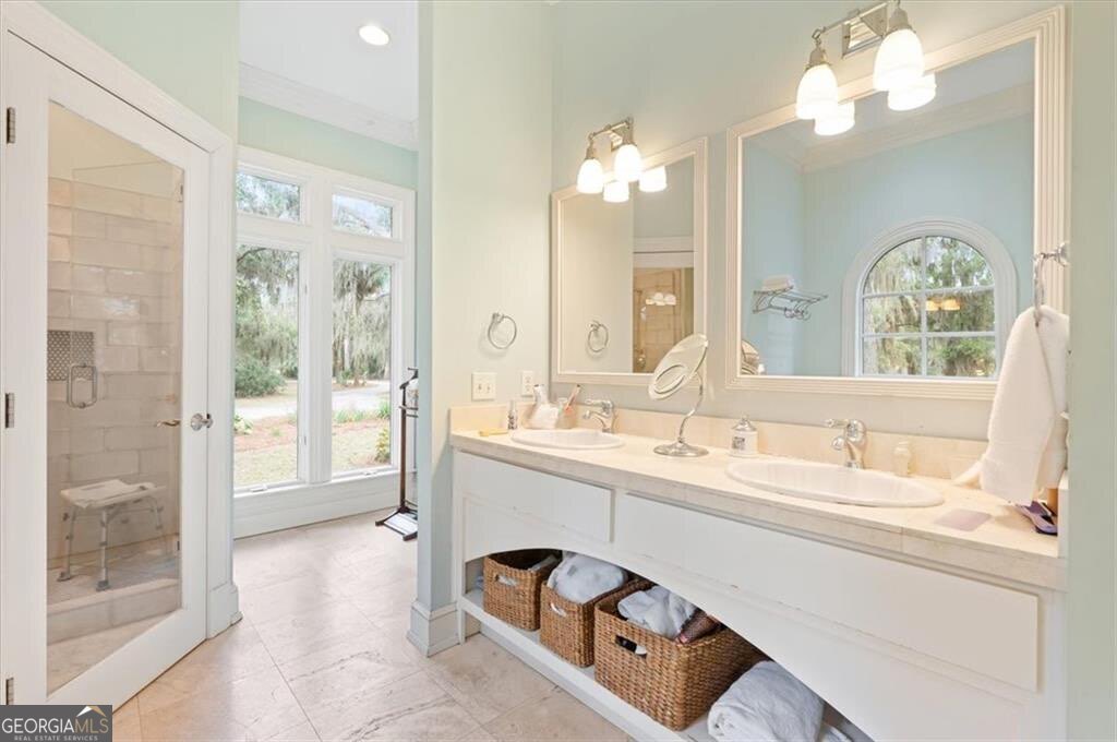 1045 River Club Road Northeast Townsend, GA 31331 - Photo 27 of 85 a spacious bathroom with a double vanity sink a mirror and a shower