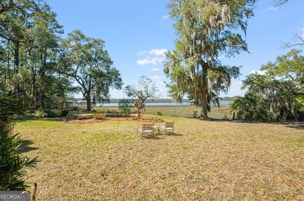 1045 River Club Road Northeast Townsend, GA 31331 - Photo 52 of 85 a view of a swimming pool with an outdoor space