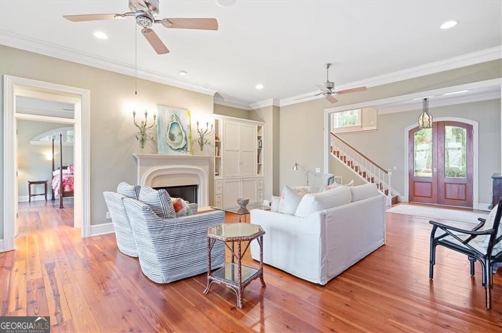 1045 River Club Road Northeast Townsend, GA 31331 - Photo 10 of 85 a living room with furniture and a fireplace