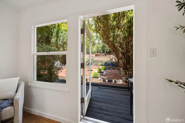 a view of a balcony with wooden floor