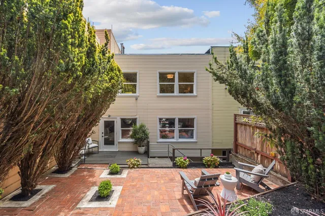 front view of a house with a rug