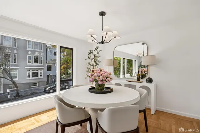 a dining room with furniture and window