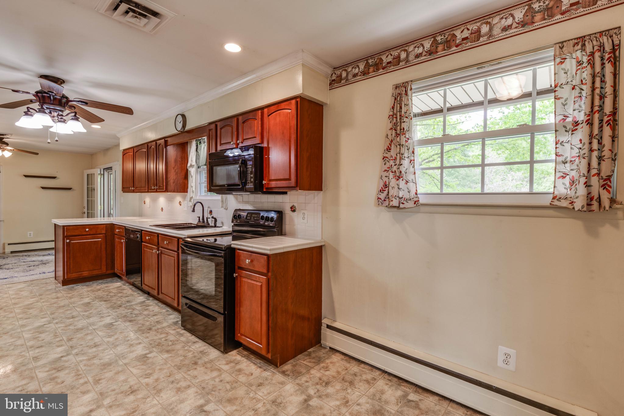2500 Crestview Drive Fallston, MD 21047 - Photo 14 of 30 a kitchen with stainless steel appliances granite countertop a stove a sink and a microwave