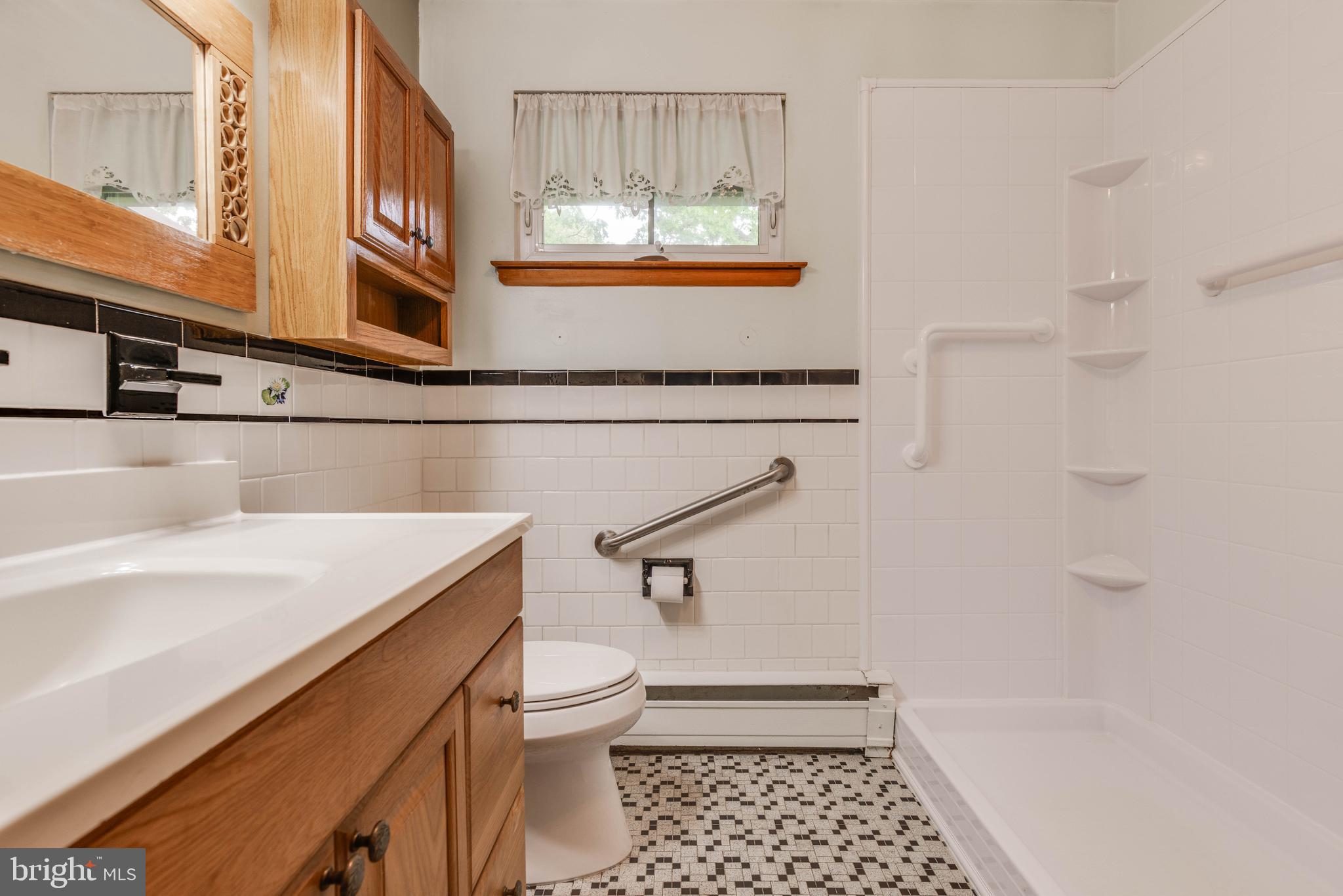 2500 Crestview Drive Fallston, MD 21047 - Photo 22 of 30 a bathroom with a sink a toilet and a window