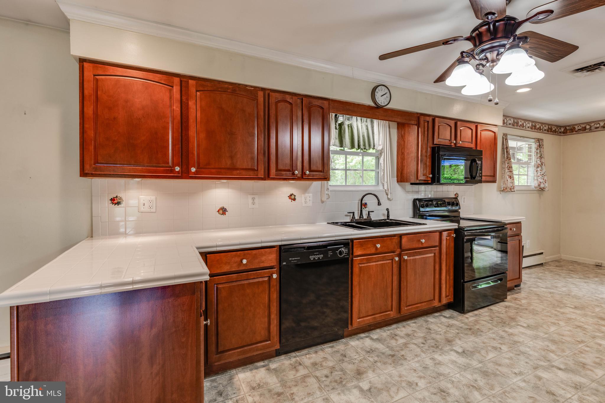 2500 Crestview Drive Fallston, MD 21047 - Photo 6 of 30 a kitchen with stainless steel appliances granite countertop a sink dishwasher stove and cabinets