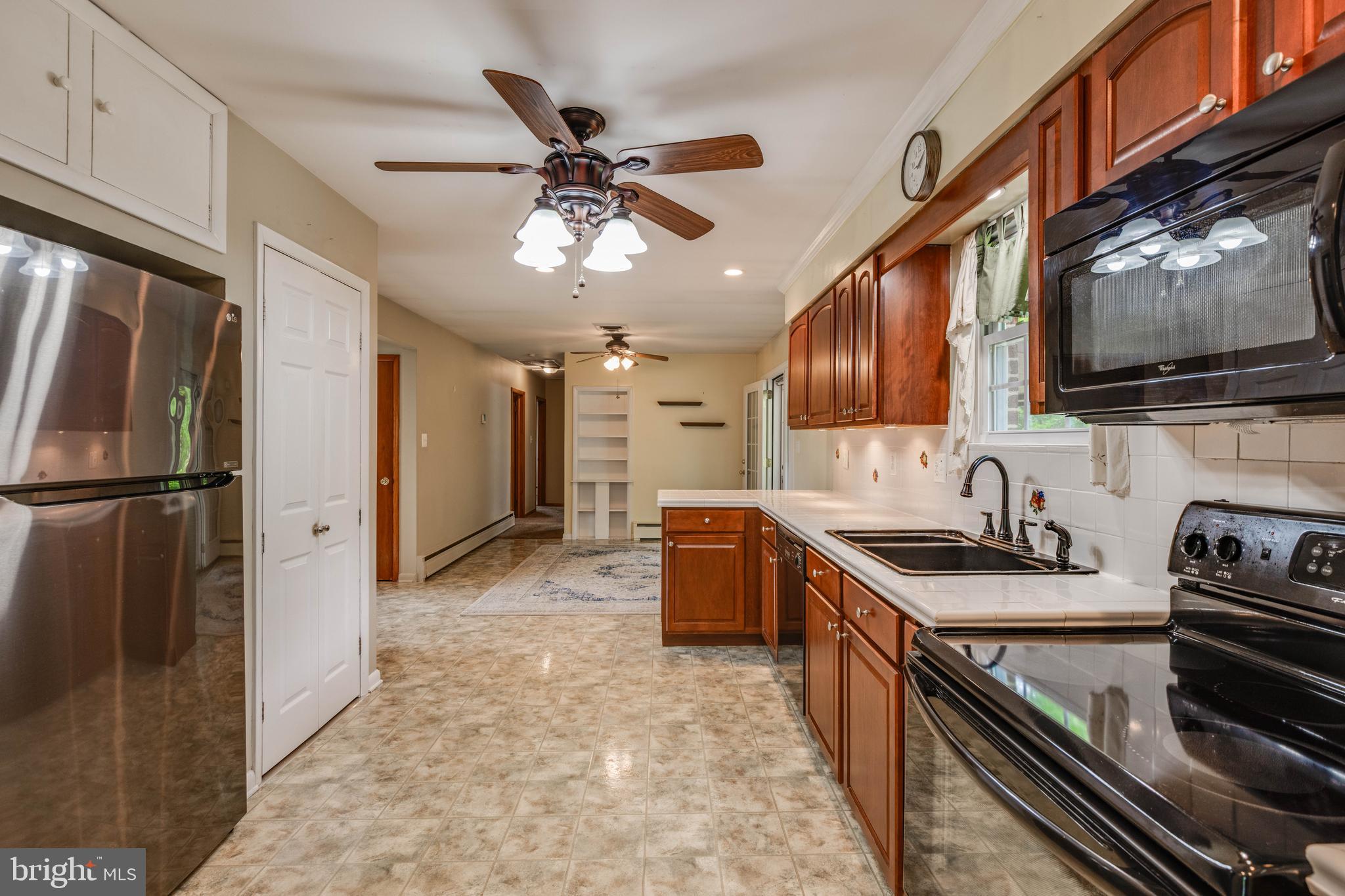 2500 Crestview Drive Fallston, MD 21047 - Photo 9 of 30 a kitchen with stainless steel appliances granite countertop a stove refrigerator and microwave