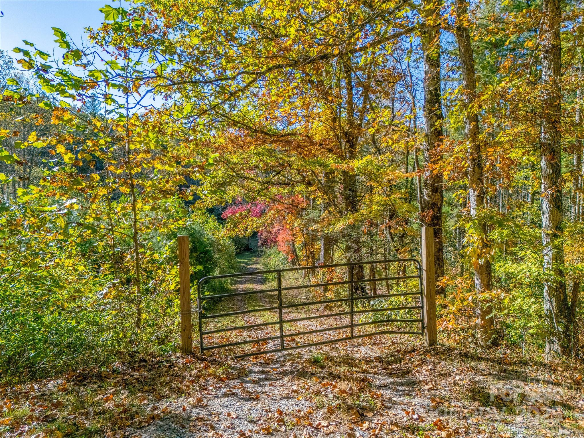 4111 Bobs Creek Road Zirconia, NC 28790 - Photo 34 of 48 a view of a bench with wooden fence