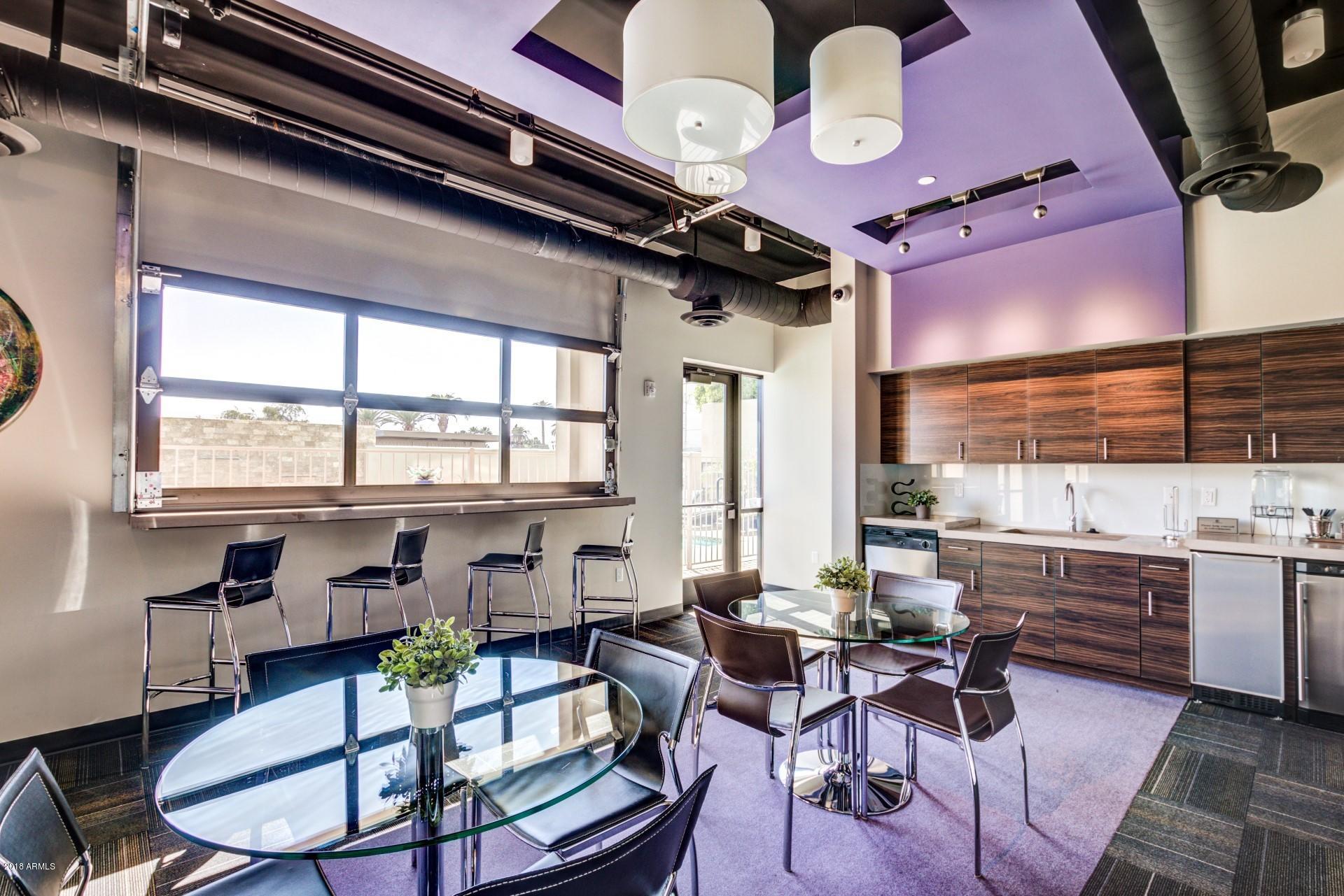 535 West Thomas Road, Unit 208 Phoenix, AZ 85013 - Photo 16 of 22 a room with lots of furniture and white walls