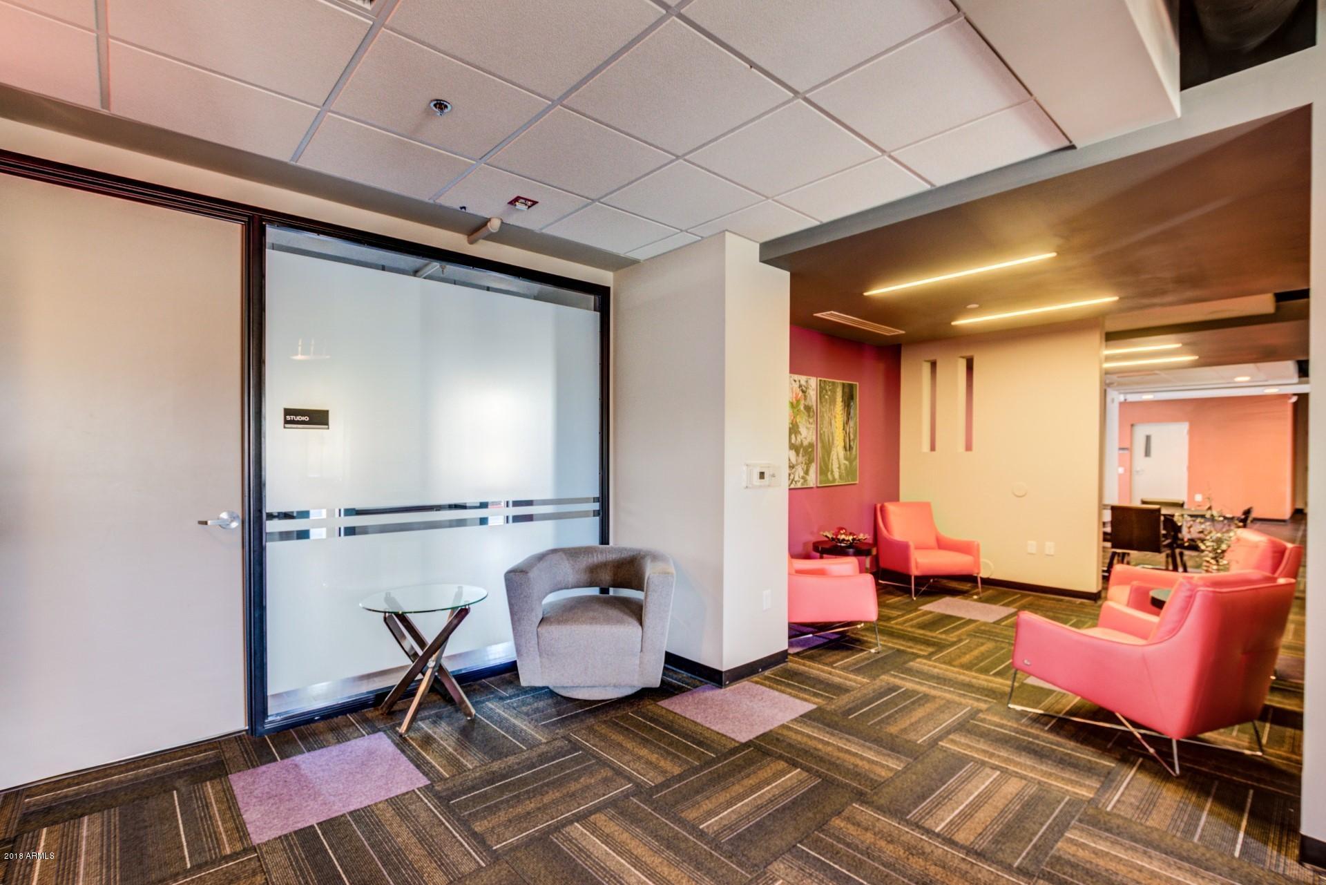 535 West Thomas Road, Unit 208 Phoenix, AZ 85013 - Photo 18 of 22 a living room with furniture and wooden floor