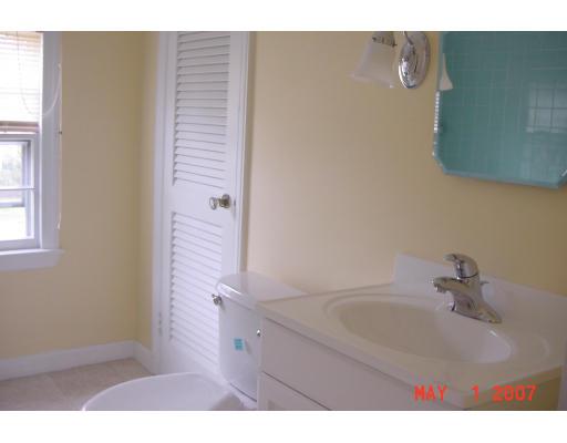 124 Oregon Street Springfield, MA 01118 - Photo 8 of 12 a bathroom with a sink and a mirror