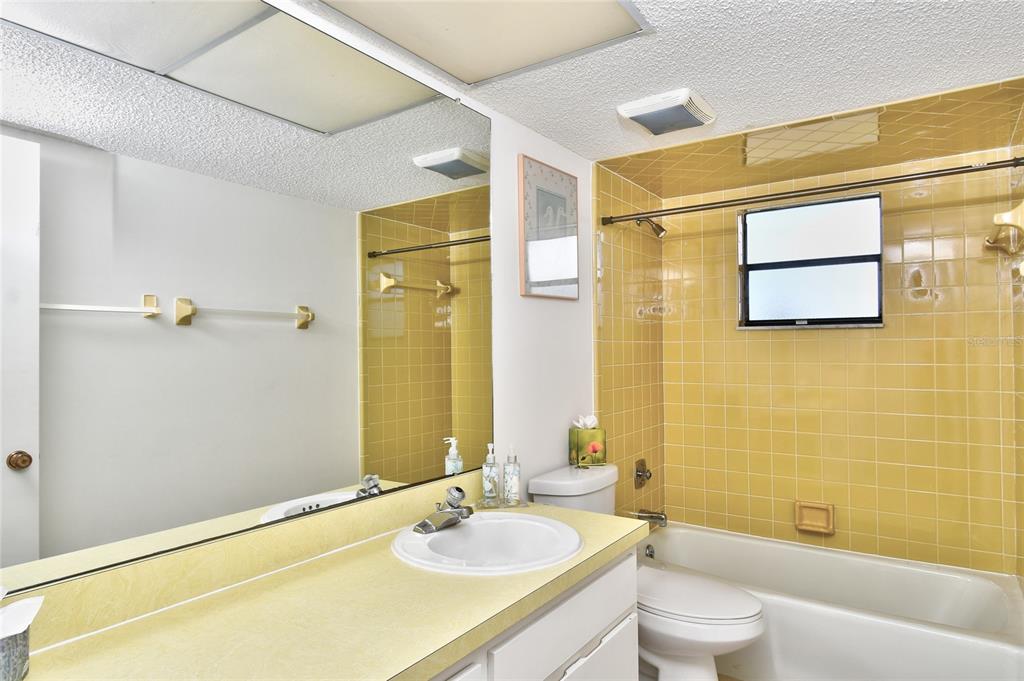 2001 Little Pine Circle, Unit 11B Punta Gorda, FL 33955 - Photo 28 of 45 a bathroom with a sink mirror toilet and bathtub