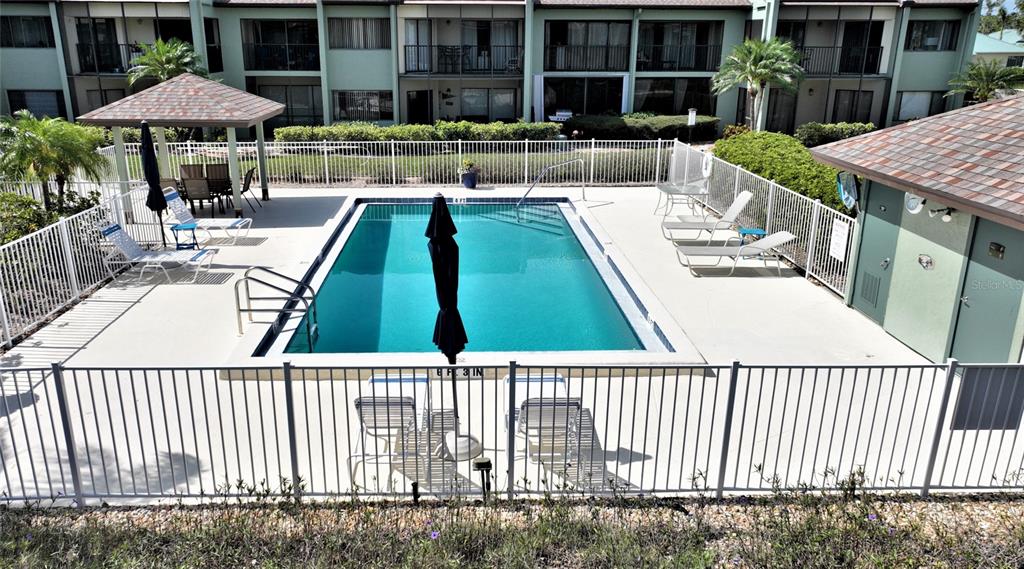 2001 Little Pine Circle, Unit 11B Punta Gorda, FL 33955 - Photo 29 of 45 a view of a patio with chairs and table with chairs