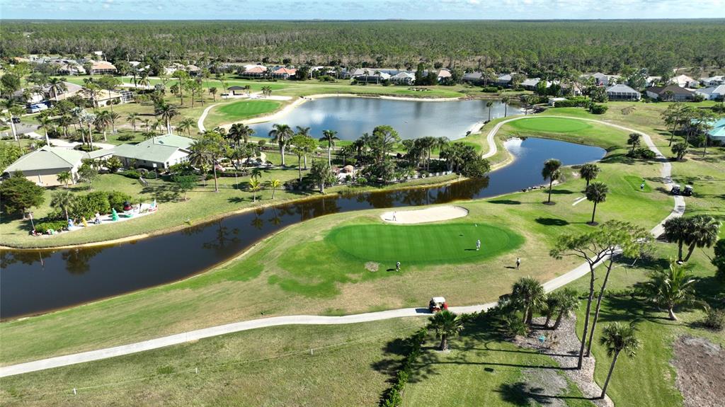 2001 Little Pine Circle, Unit 11B Punta Gorda, FL 33955 - Photo 43 of 45 an aerial view of residential houses with outdoor space and lake view