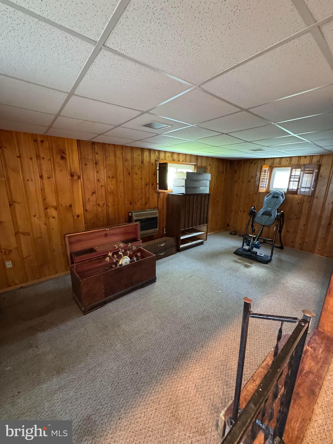 6703 Alter Street Baltimore, MD 21207 - Photo 8 of 12 a room with gym equipment and a large window