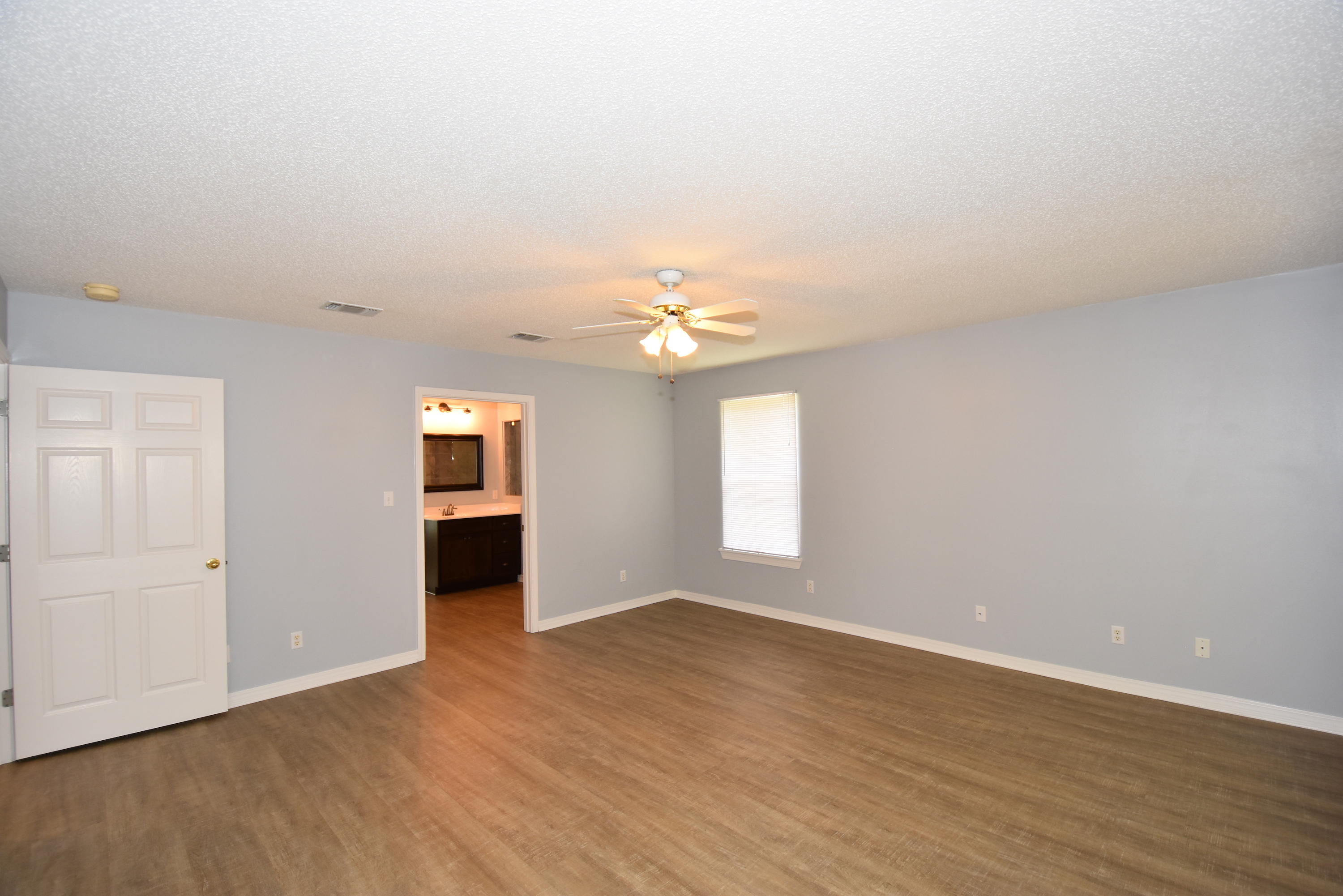 5817 Dairy Road Baker, FL 32531 - Photo 16 of 36 wooden floor in an empty room with a window