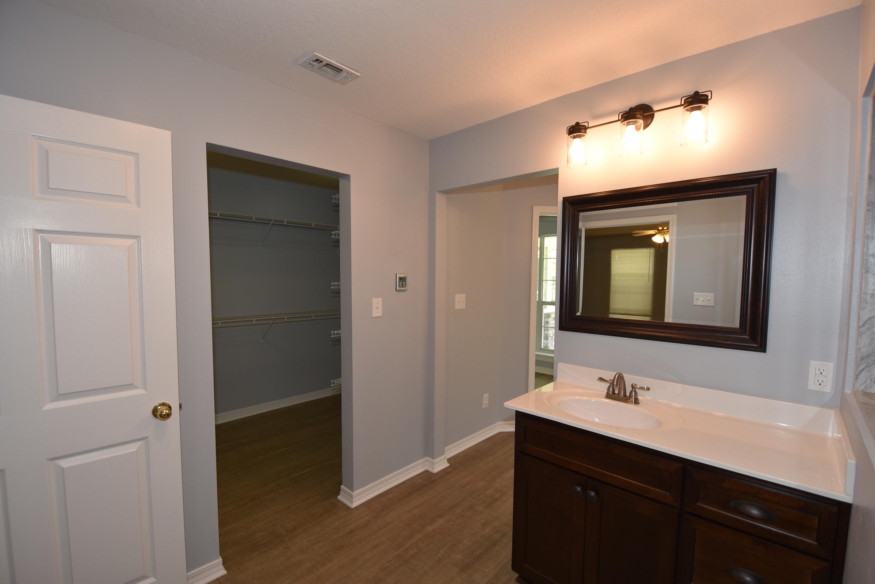 5817 Dairy Road Baker, FL 32531 - Photo 18 of 36 a bathroom with a sink vanity and a mirror