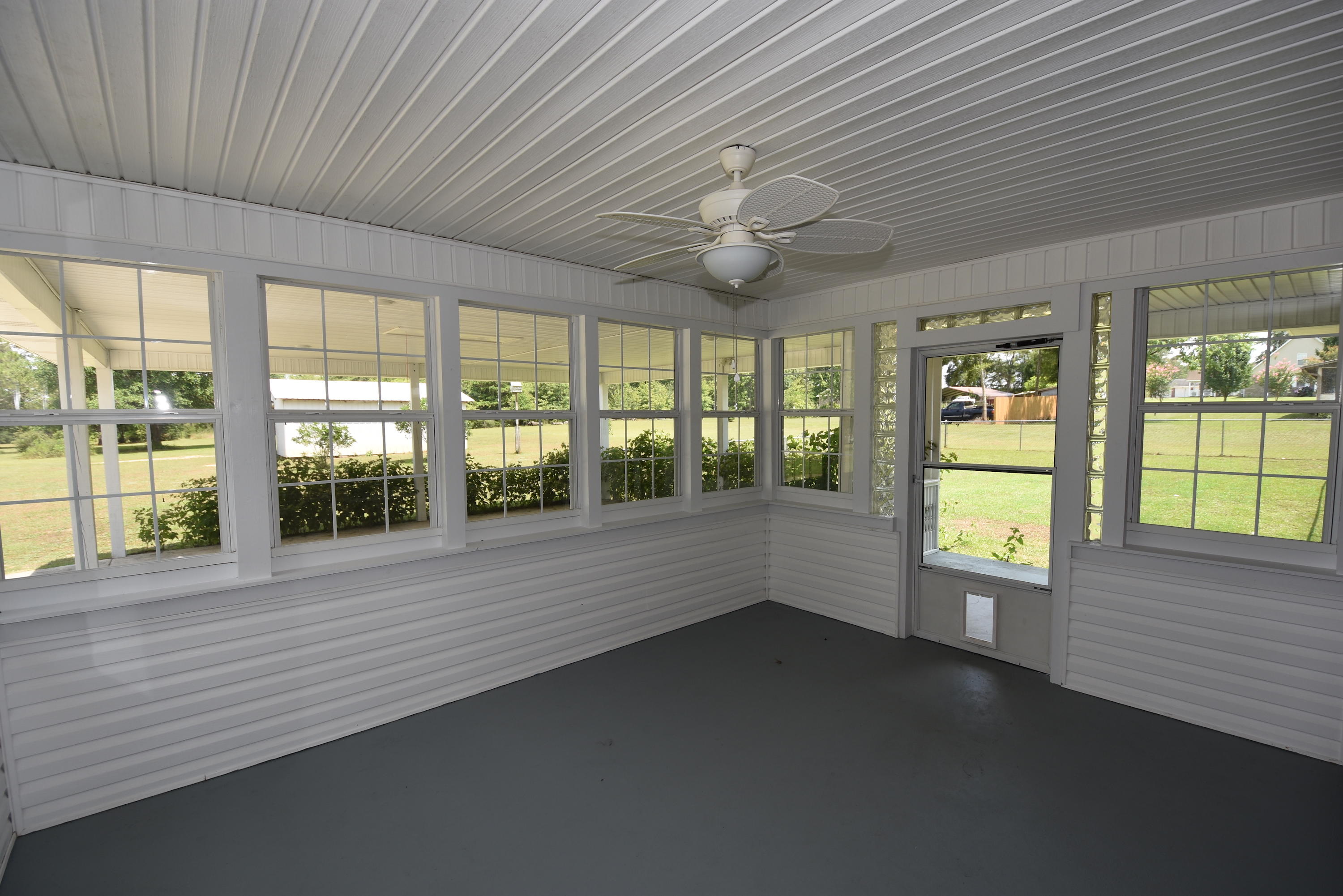 5817 Dairy Road Baker, FL 32531 - Photo 21 of 36 wooden floor in an empty room with a large window