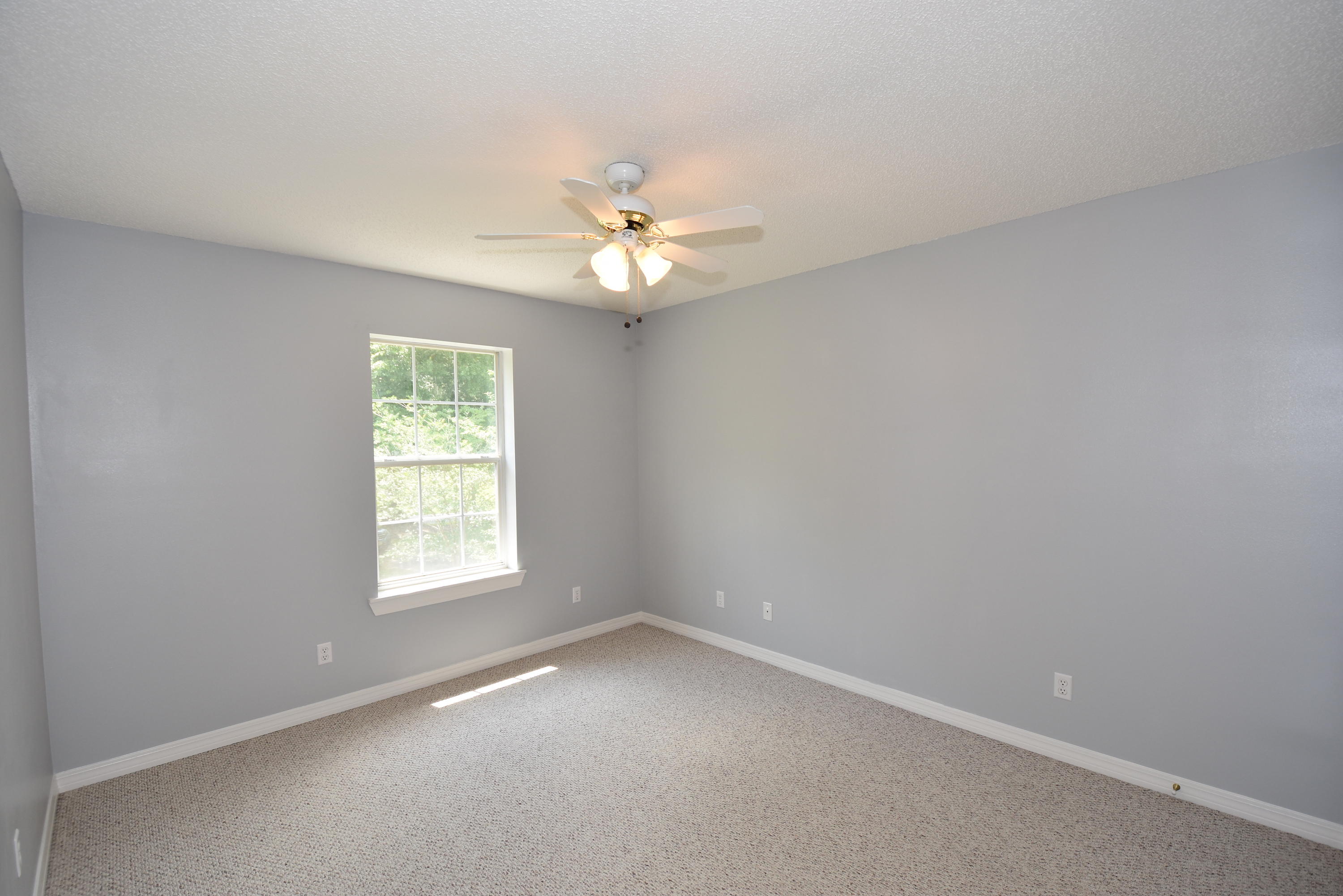 5817 Dairy Road Baker, FL 32531 - Photo 26 of 36 an empty room with a window and a ceiling fan
