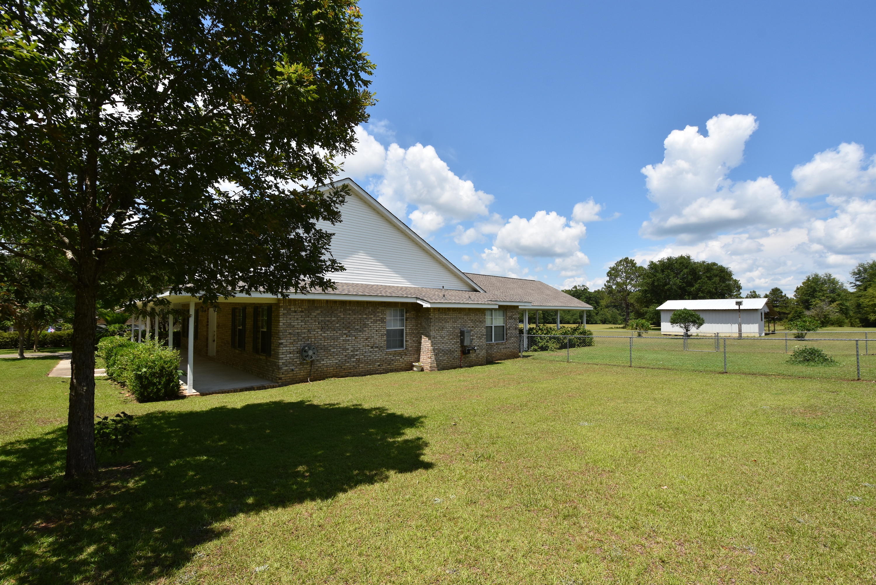 5817 Dairy Road Baker, FL 32531 - Photo 27 of 36 a front view of a house with garden